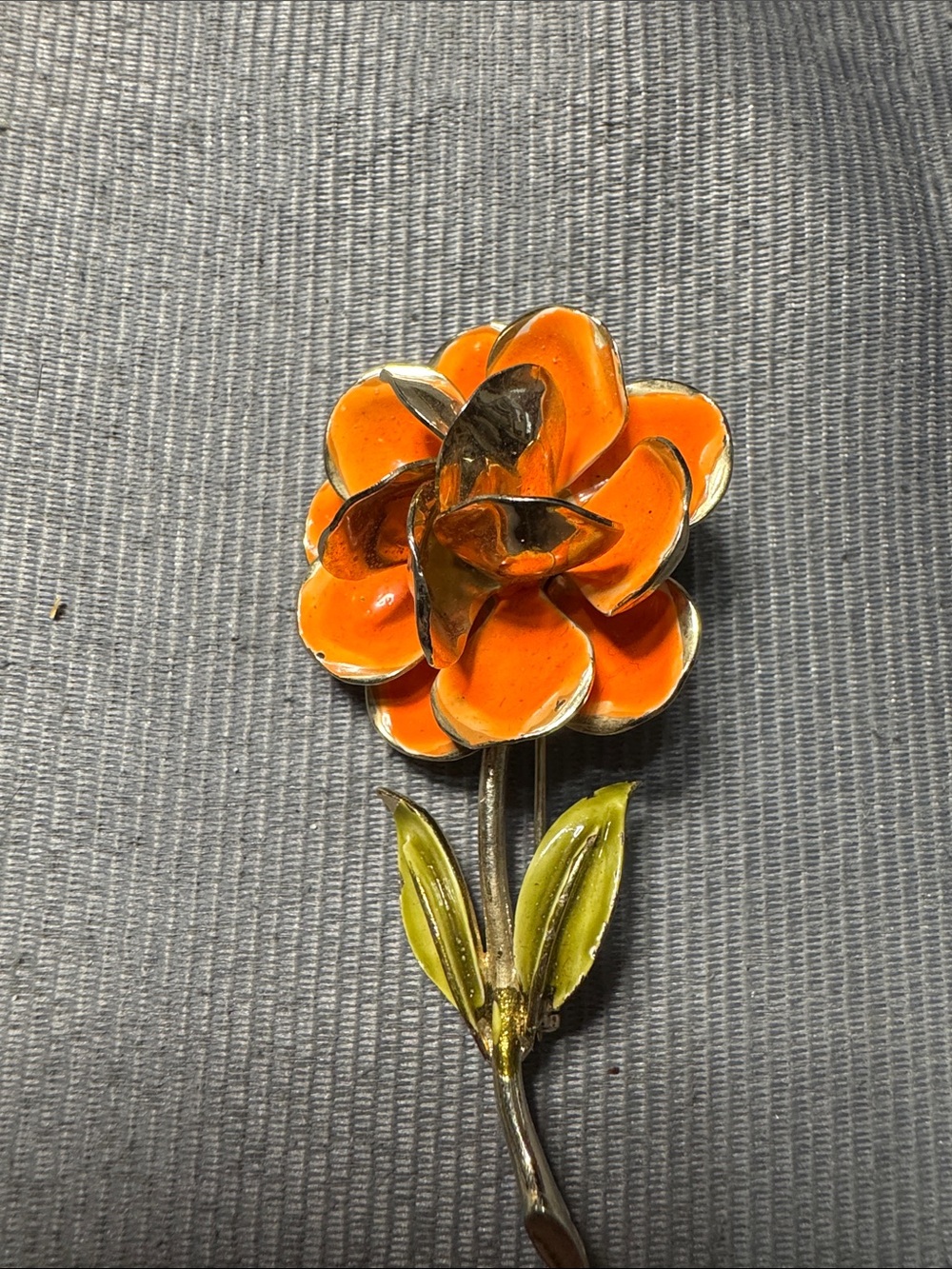 Vintage Source Unknown Orange Enamel Flower Brooch with Green Leaves